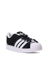 Baskets basses en cuir noires adidas