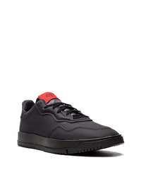 Baskets basses en cuir noires adidas