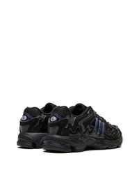 Baskets basses en cuir noires adidas