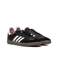 Baskets basses en cuir noires adidas