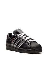 Baskets basses en cuir noires adidas