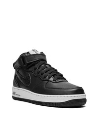 Baskets basses en cuir noires Nike