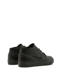 Baskets basses en cuir noires Nike