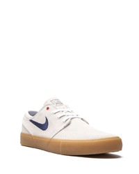 Baskets basses en daim blanches Nike