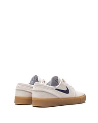 Baskets basses en daim blanches Nike