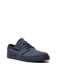 Baskets basses en daim bleu marine Nike