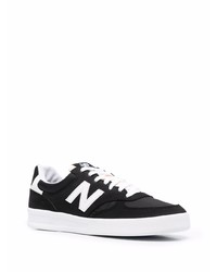 Baskets basses en daim noires et blanches New Balance