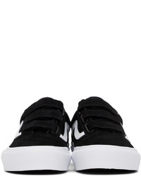 Baskets basses en daim noires et blanches Vans