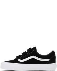 Baskets basses en daim noires et blanches Vans