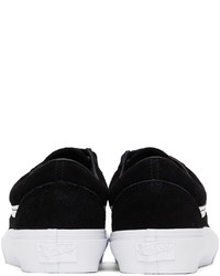 Baskets basses en daim noires et blanches Vans