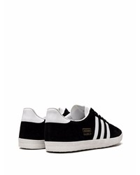 Baskets basses en daim noires et blanches adidas