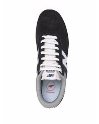 Baskets basses en daim noires et blanches New Balance