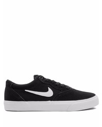 Baskets basses en daim noires et blanches Nike