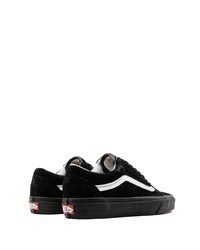 Baskets basses en daim noires et blanches Vans