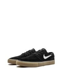 Baskets basses en daim noires et blanches Nike