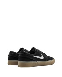 Baskets basses en daim noires et blanches Nike