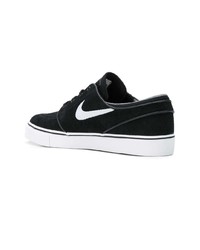 Baskets basses en daim noires Nike