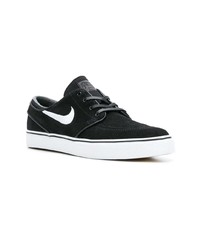 Baskets basses en daim noires Nike