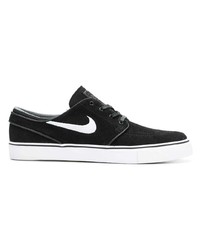 Baskets basses en daim noires Nike