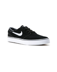 Baskets basses en daim noires Nike