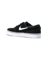 Baskets basses en daim noires Nike