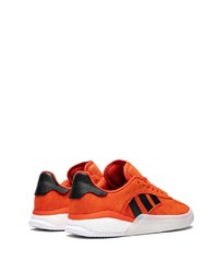 Baskets basses en daim orange adidas