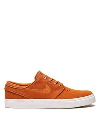 Baskets basses en daim orange Nike