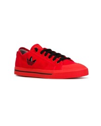 Baskets basses en daim rouges Adidas By Raf Simons