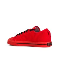 Baskets basses en daim rouges Adidas By Raf Simons