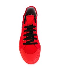 Baskets basses en daim rouges Adidas By Raf Simons