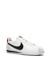 Baskets basses en toile blanches et noires Nike