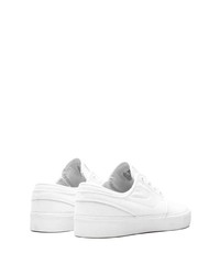 Baskets basses en toile blanches Nike