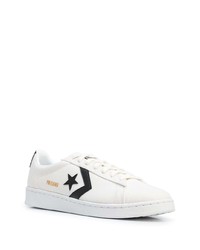 Baskets basses en toile imprimées blanches et noires Converse