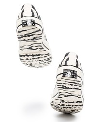 Baskets basses en toile imprimées blanches et noires Converse