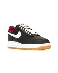 Baskets basses en toile noires et blanches Nike