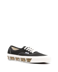 Baskets basses en toile noires et blanches Vans