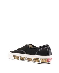 Baskets basses en toile noires et blanches Vans