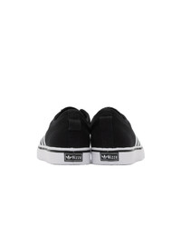 Baskets basses en toile noires et blanches adidas Originals