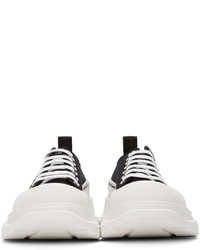 Baskets basses en toile noires et blanches Alexander McQueen