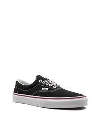 Baskets basses en toile noires et blanches Vans