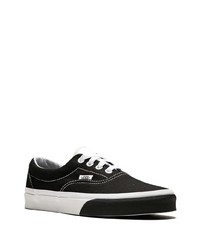 Baskets basses en toile noires et blanches Vans