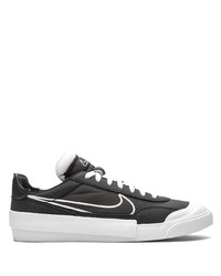 Baskets basses en toile noires et blanches Nike