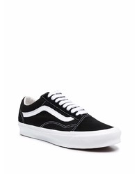 Baskets basses en toile noires et blanches Vans