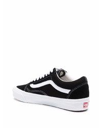 Baskets basses en toile noires et blanches Vans