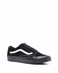 Baskets basses en toile noires et blanches Vans