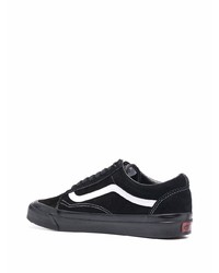 Baskets basses en toile noires et blanches Vans