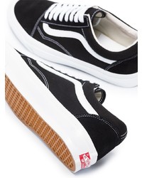 Baskets basses en toile noires et blanches Vans