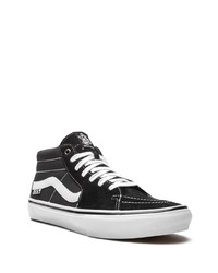 Baskets basses en toile noires et blanches Vans