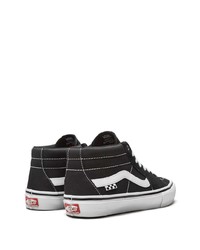 Baskets basses en toile noires et blanches Vans