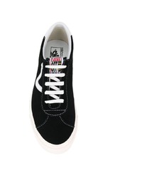 Baskets basses en toile noires et blanches Vans